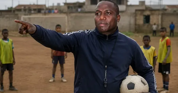 Isaac Mina y unos jóvenes futbolistas